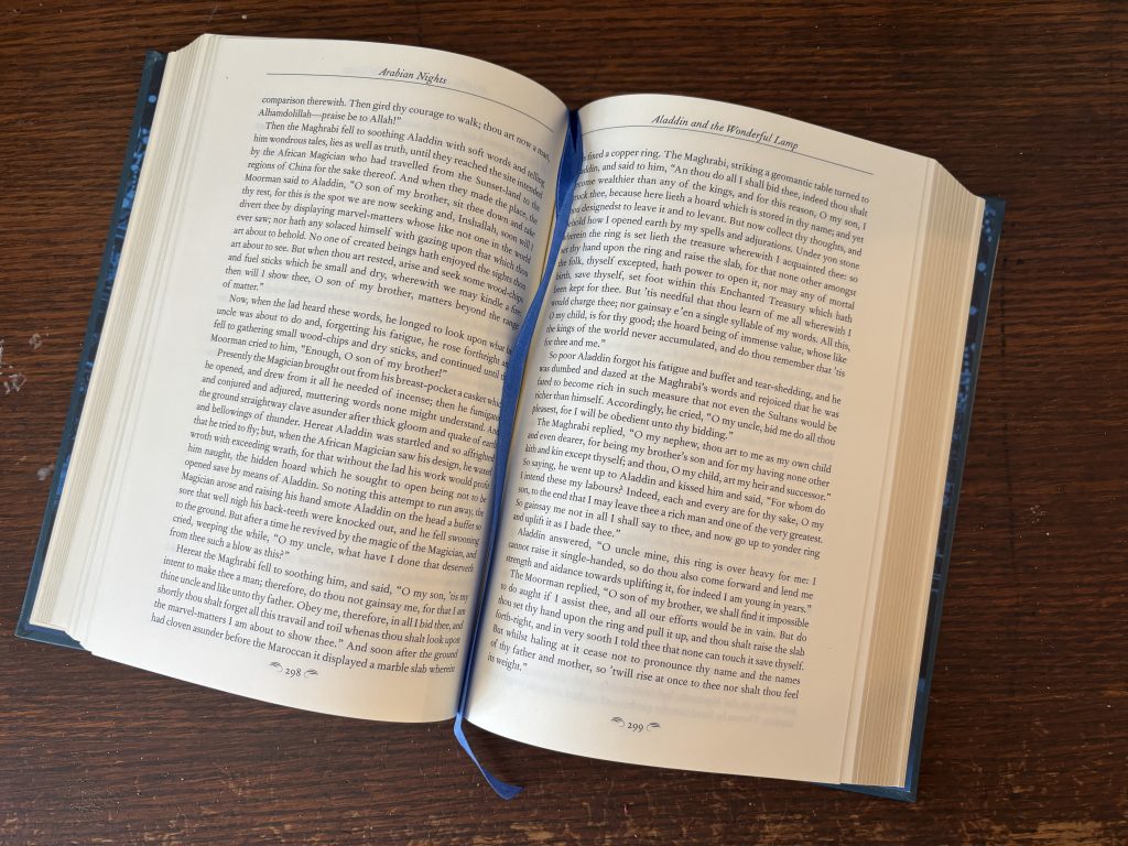 The same book, opened up showing the ribbon bookmark.